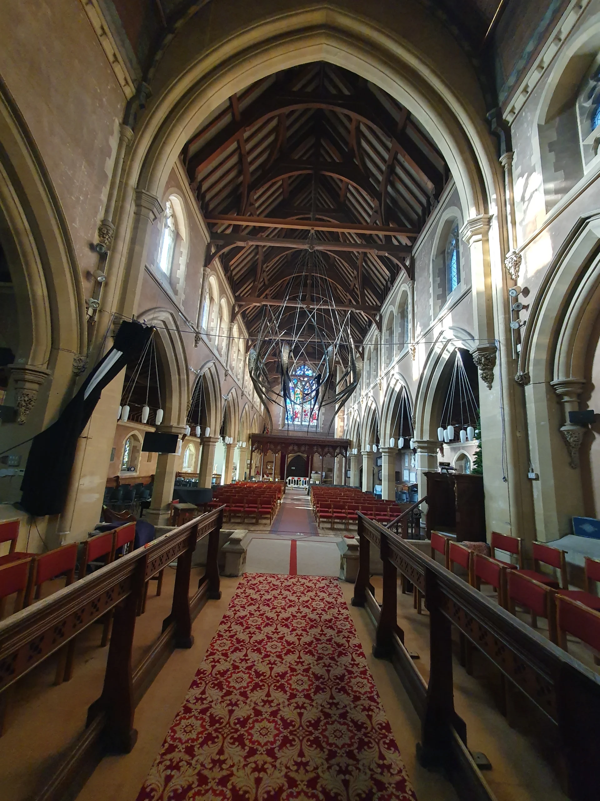 Upton Upon Severn 12 Inside the church of St Peter & ST Paul - with a mental structure art piece hanging from the ceiling.