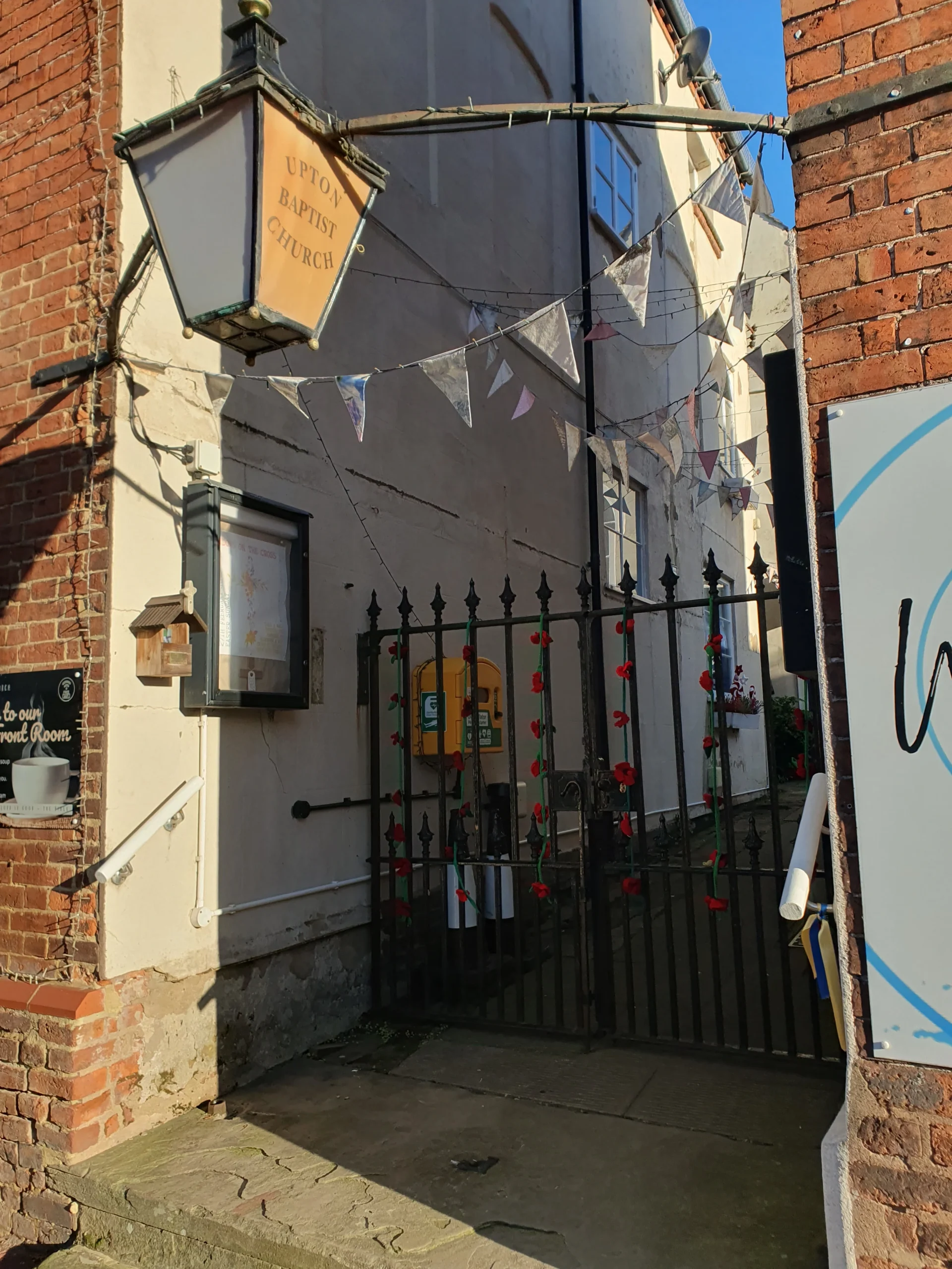 Upton Upon Severn 13 The unknown entrance of Baptist church with cast iron gates - between two building