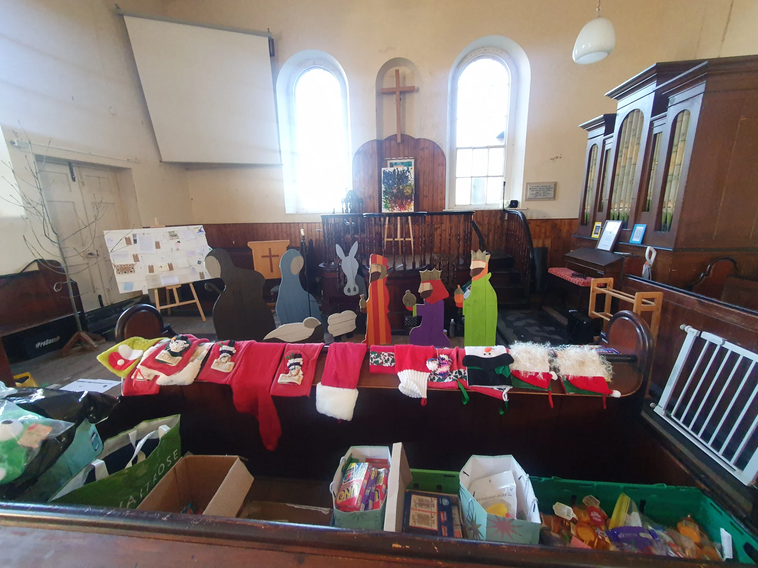 Upton Upon Severn 14 Inside the Baptist church - with Christmas staging props and food bank for the needed.