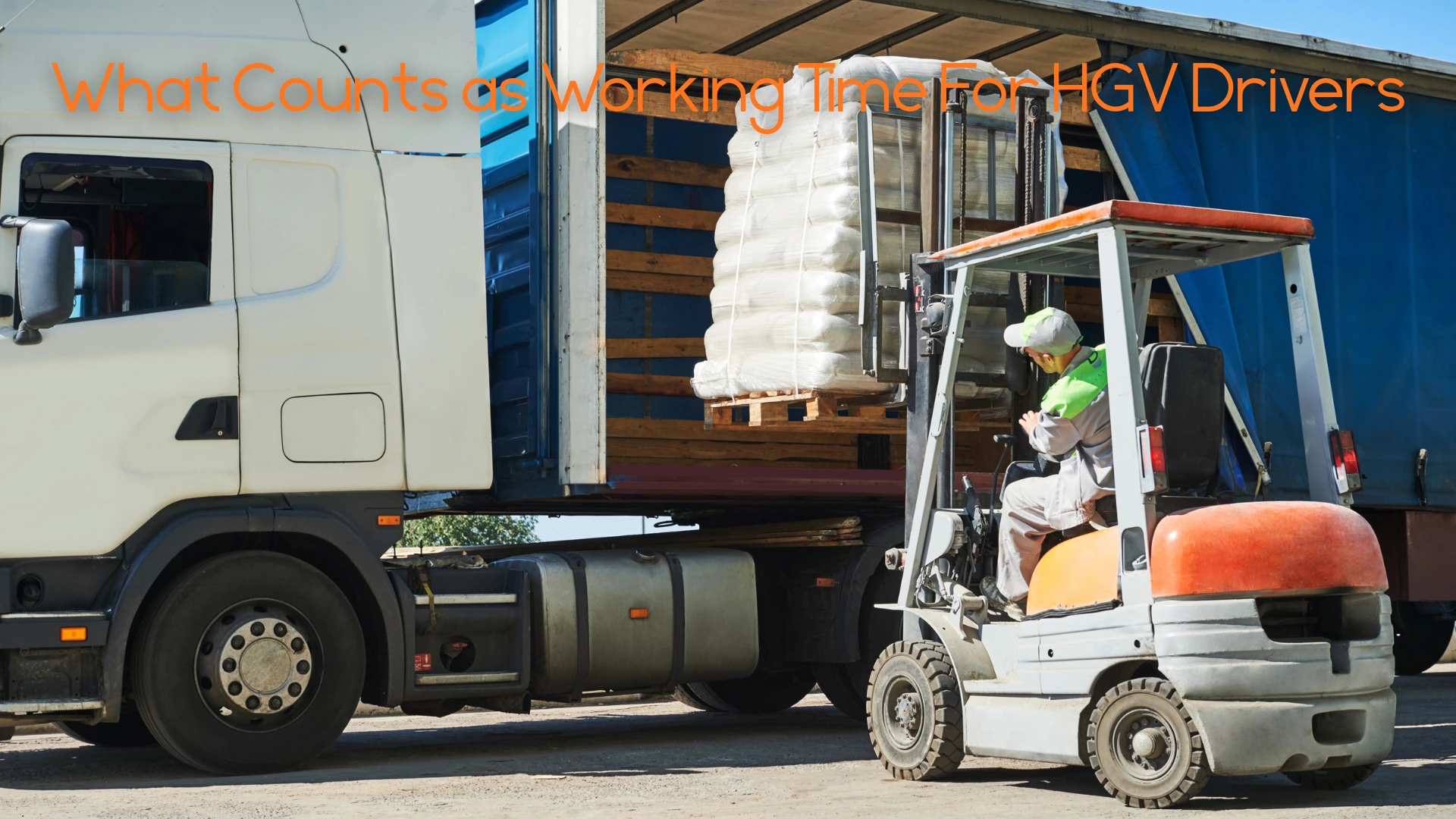 A HGV getting loaded by a forklift.